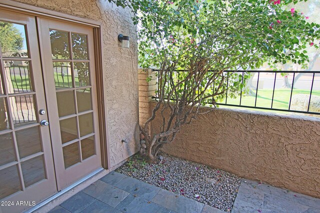 exterior space featuring french doors and a balcony