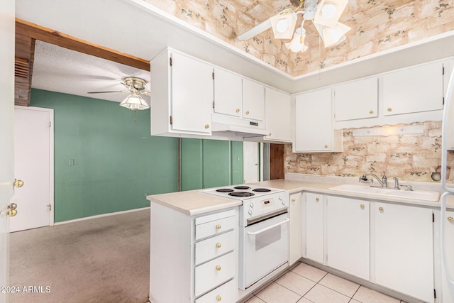 kitchen with white cabinets, sink, electric range, ceiling fan, and light tile patterned flooring