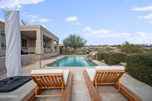 view of pool featuring a patio