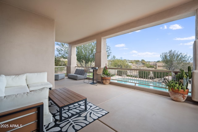 view of patio with an outdoor hangout area and a fenced in pool