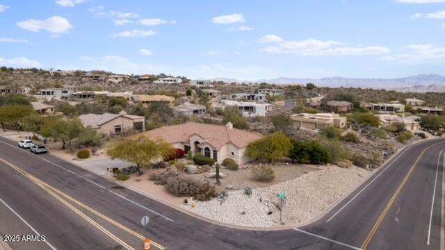 birds eye view of property featuring a mountain view