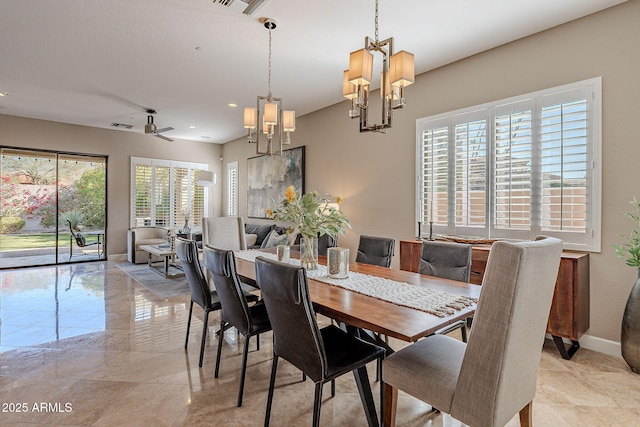 dining area featuring an inviting chandelier