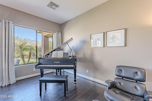 living area featuring dark wood-type flooring, lofted ceiling, and a mountain view