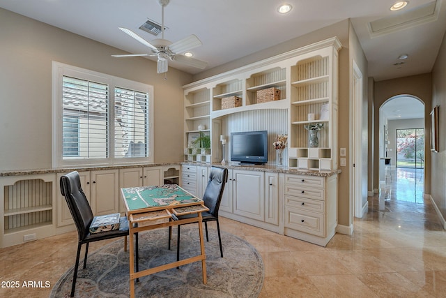 tiled dining room with ceiling fan