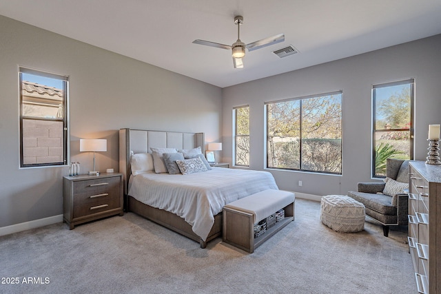 bedroom with light carpet and ceiling fan