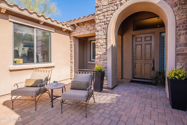 property entrance with a patio