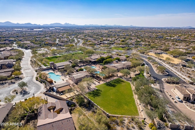 birds eye view of property with a mountain view