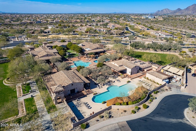 birds eye view of property with a mountain view