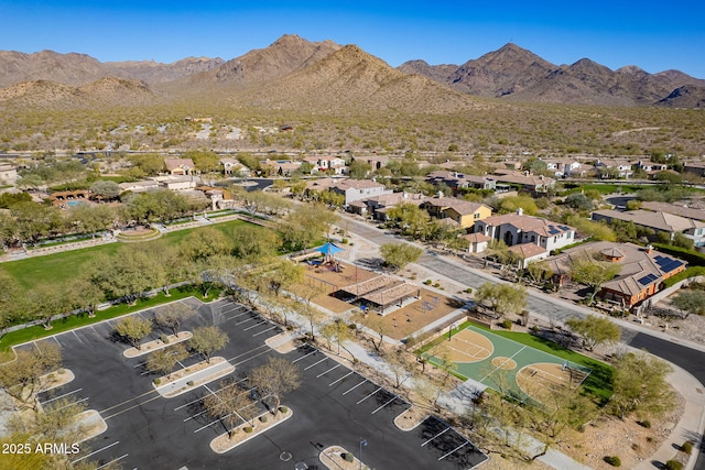 birds eye view of property featuring a mountain view