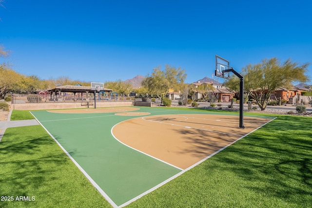 view of sport court featuring a gazebo and a lawn