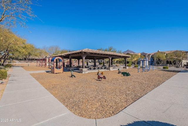 view of community featuring a playground and a gazebo