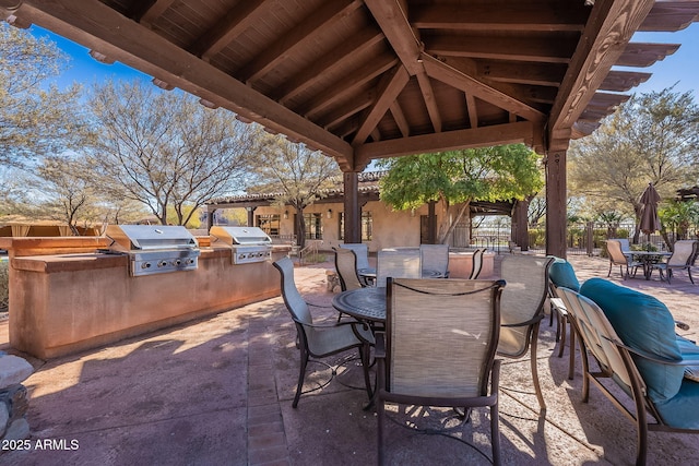 view of patio / terrace with a grill, area for grilling, and a gazebo