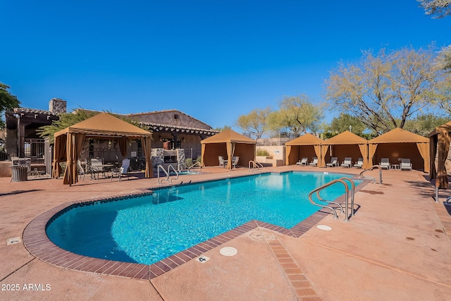 view of swimming pool featuring a gazebo, a pergola, and a patio area