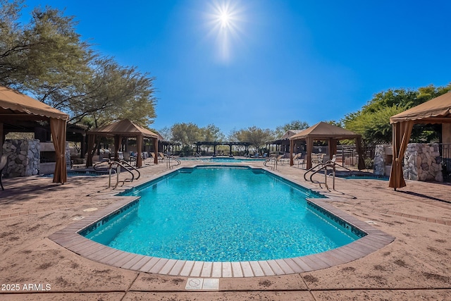 view of swimming pool featuring a gazebo