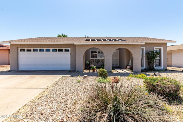 5221 W Garden Dr, Glendale, AZ 85304 - single story home featuring concrete driveway, an attached garage, a shingled roof, and stucco siding