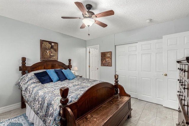 5221 W Garden Dr, Glendale, AZ 85304 - bedroom featuring a closet, baseboards, a ceiling fan, and a textured ceiling