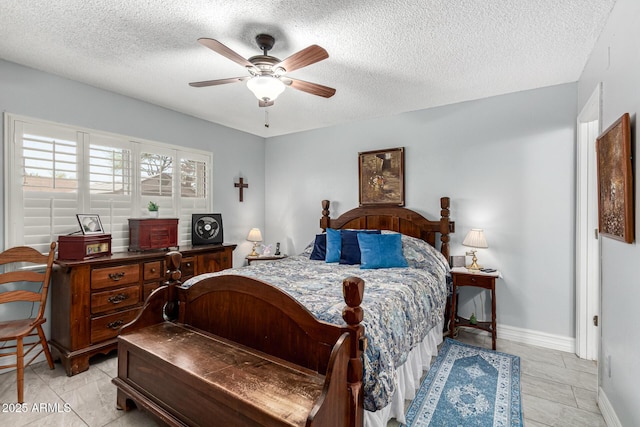 5221 W Garden Dr, Glendale, AZ 85304 - bedroom featuring baseboards, a ceiling fan, and a textured ceiling