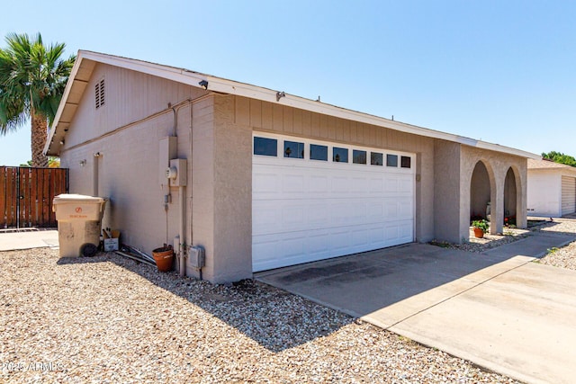 5221 W Garden Dr, Glendale, AZ 85304 - garage featuring concrete driveway and fence