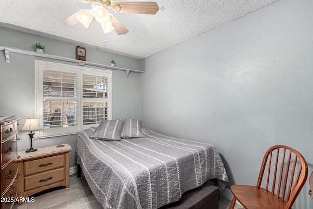 5221 W Garden Dr, Glendale, AZ 85304 - bedroom featuring a textured ceiling and a ceiling fan