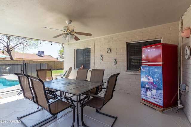 5221 W Garden Dr, Glendale, AZ 85304 - view of patio / terrace with a fenced in pool, outdoor dining space, a fenced backyard, and ceiling fan
