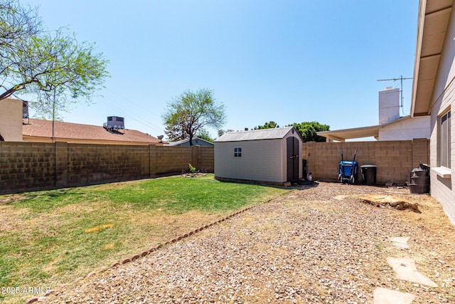 5221 W Garden Dr, Glendale, AZ 85304 - view of yard featuring a shed, a fenced backyard, and an outdoor structure
