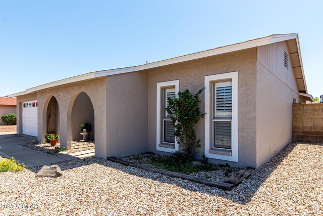 5221 W Garden Dr, Glendale, AZ 85304 - view of front of property with an attached garage and stucco siding