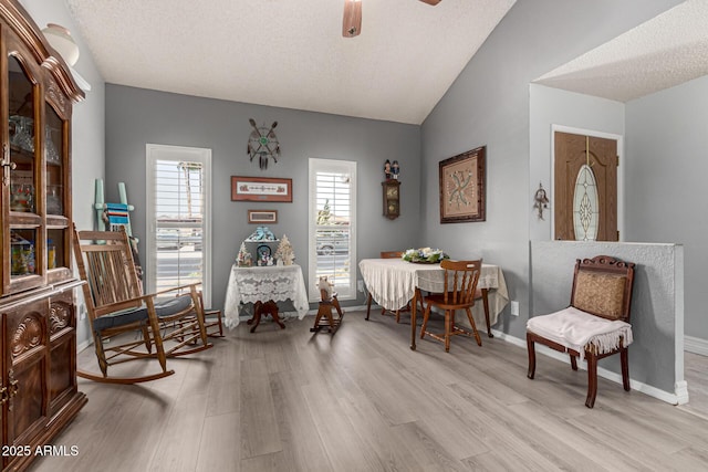 5221 W Garden Dr, Glendale, AZ 85304 - sitting room with light wood-style floors, baseboards, a ceiling fan, and lofted ceiling