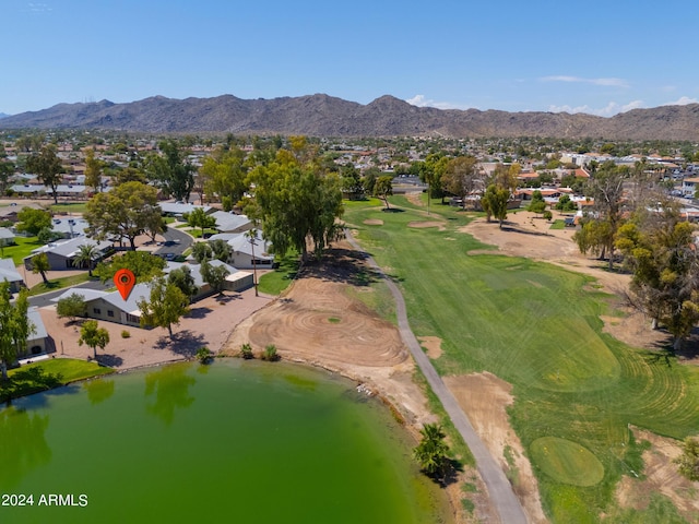 aerial view featuring a residential view, golf course view, and a water and mountain view