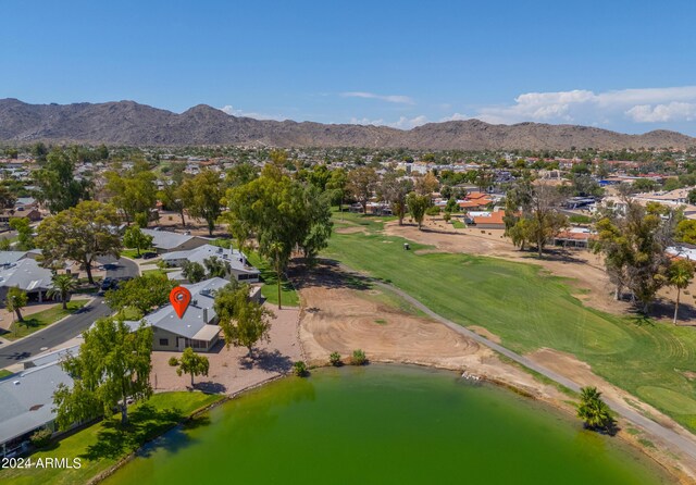 bird's eye view with a water and mountain view