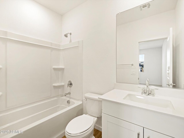 full bathroom featuring shower / washtub combination, vanity, and toilet