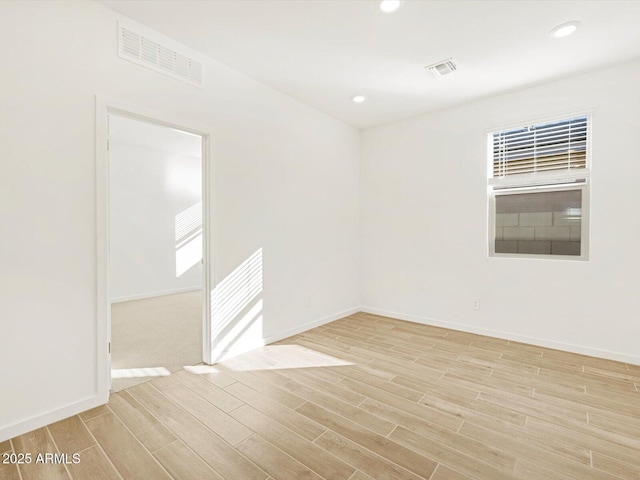 unfurnished room featuring light wood-type flooring