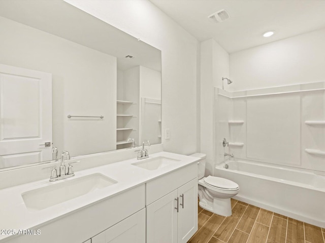 full bathroom featuring vanity, shower / tub combination, and toilet