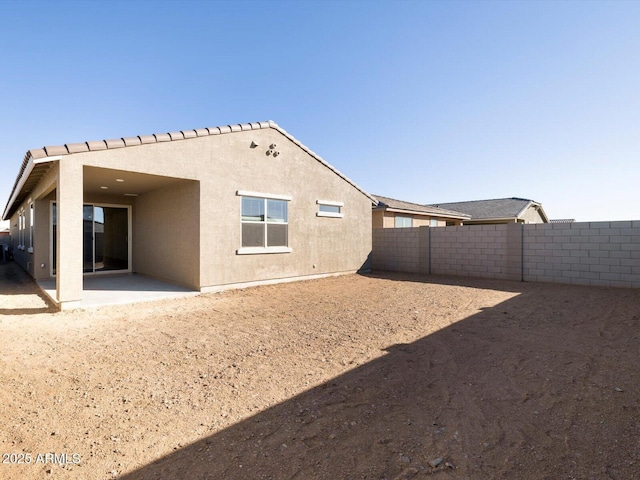 rear view of property with a patio area