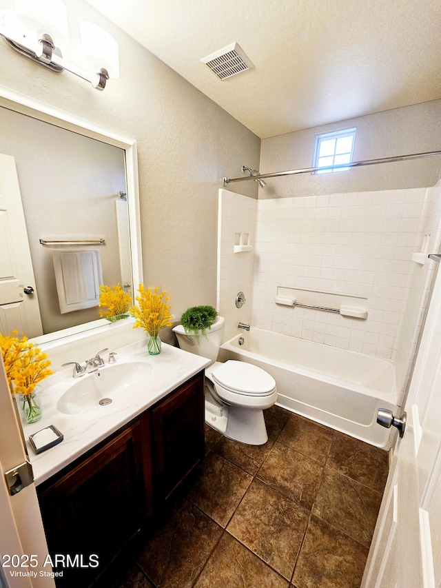 full bathroom featuring shower / tub combination, visible vents, toilet, and vanity