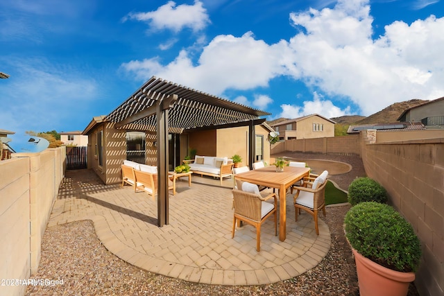 view of patio with an outdoor living space, a fenced backyard, outdoor dining space, and a pergola