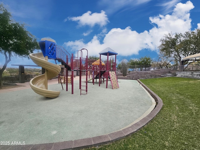 community playground with a lawn and fence