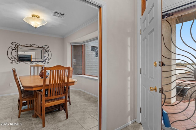 dining space featuring visible vents, baseboards, a healthy amount of sunlight, and crown molding