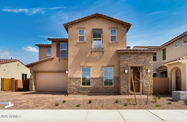 5851 S Romano, Mesa, AZ 85212 - mediterranean / spanish-style house with stone siding, a tile roof, a garage, and stucco siding