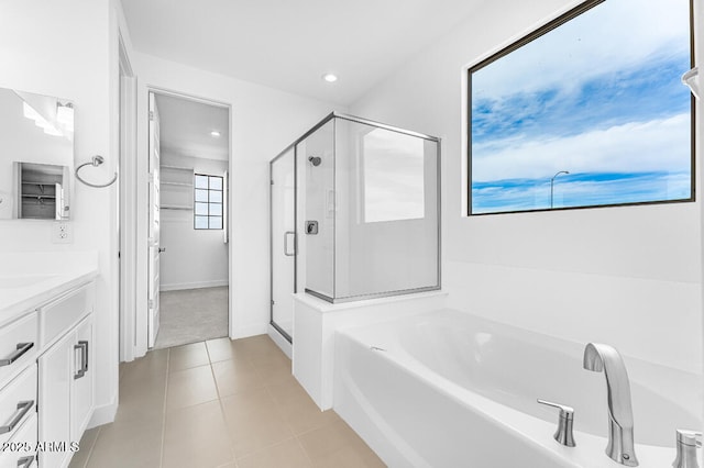 full bath featuring a bath, recessed lighting, vanity, a stall shower, and tile patterned flooring