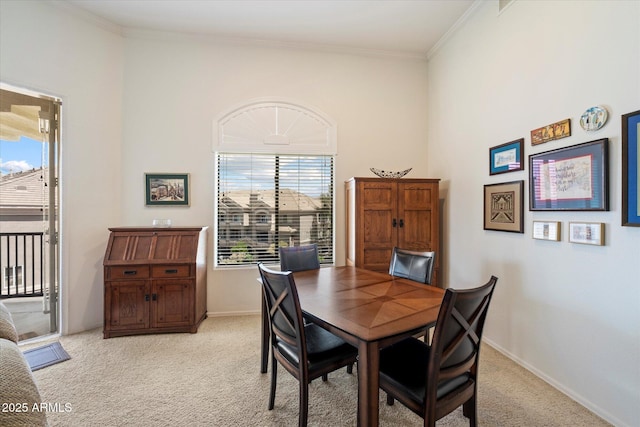 11640 N Tatum Blvd Unit 3091, Phoenix, AZ 85028 - dining room featuring crown molding, baseboards, and light carpet