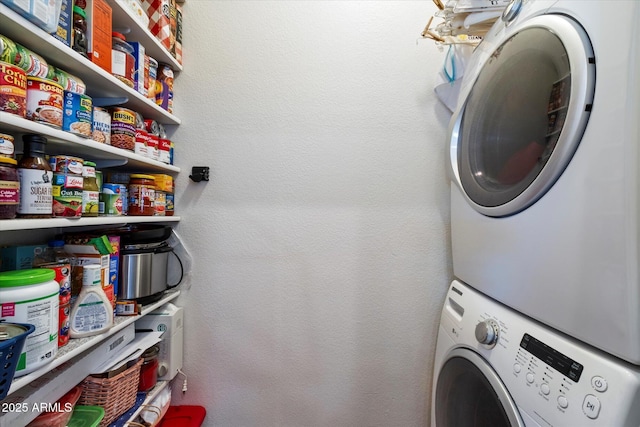 11640 N Tatum Blvd Unit 3091, Phoenix, AZ 85028 - laundry area featuring a textured wall, stacked washer and dryer, and laundry area