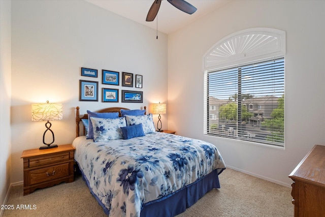 11640 N Tatum Blvd Unit 3091, Phoenix, AZ 85028 - bedroom featuring light carpet, baseboards, and a ceiling fan