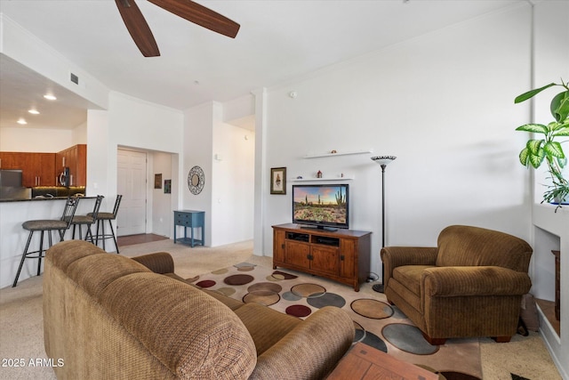 11640 N Tatum Blvd Unit 3091, Phoenix, AZ 85028 - living room featuring light carpet, ceiling fan, ornamental molding, and visible vents