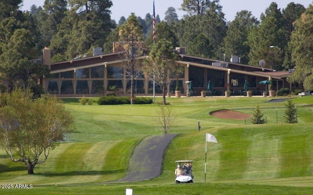 view of home's community featuring a lawn