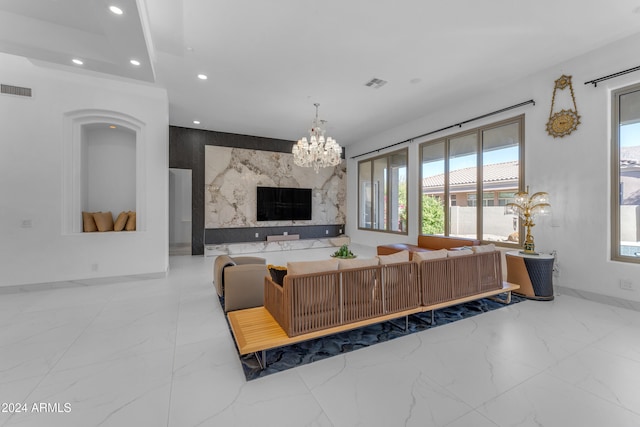 living room featuring a notable chandelier