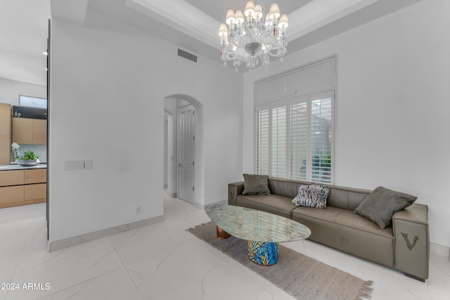 living room with a notable chandelier