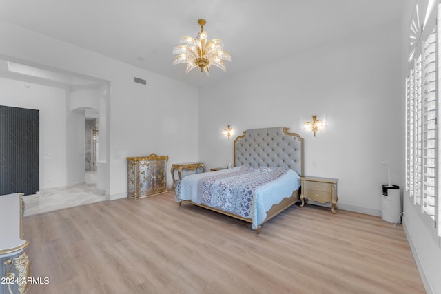 bedroom with light hardwood / wood-style floors