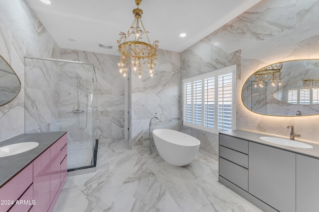 bathroom featuring vanity, tile walls, an inviting chandelier, and separate shower and tub