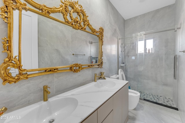 bathroom featuring toilet, vanity, tile walls, and a shower with door