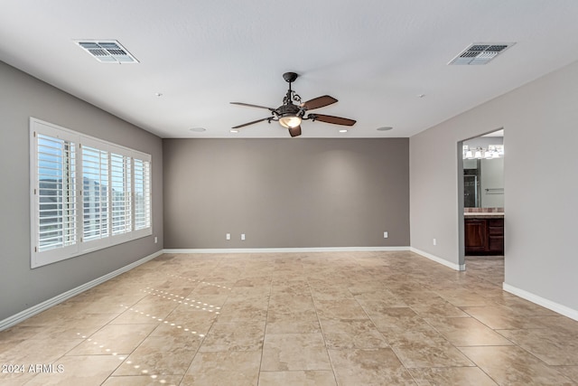 spare room with ceiling fan